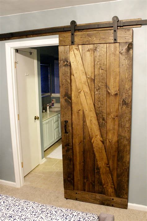 This DIY IKEA HACK barn door is all about how to make a barn door out of a live edge slab and an Ikea mirror. This is a one of a kind Ikea mirror transformat...